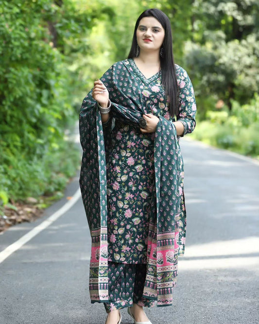 Woman in a floral dress standing on a road with greenery in the background